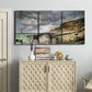 Three-panel canvas wall art featuring sunset beach with glowing sky, displayed above a cabinet in an entryway.