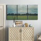 Three-panel canvas wall art featuring rolling green pastoral fields, displayed above a cabinet in an entryway.