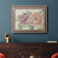 Modern peony floral drawing in an ornate traditional silver frame displayed in a dark-toned interior setting.