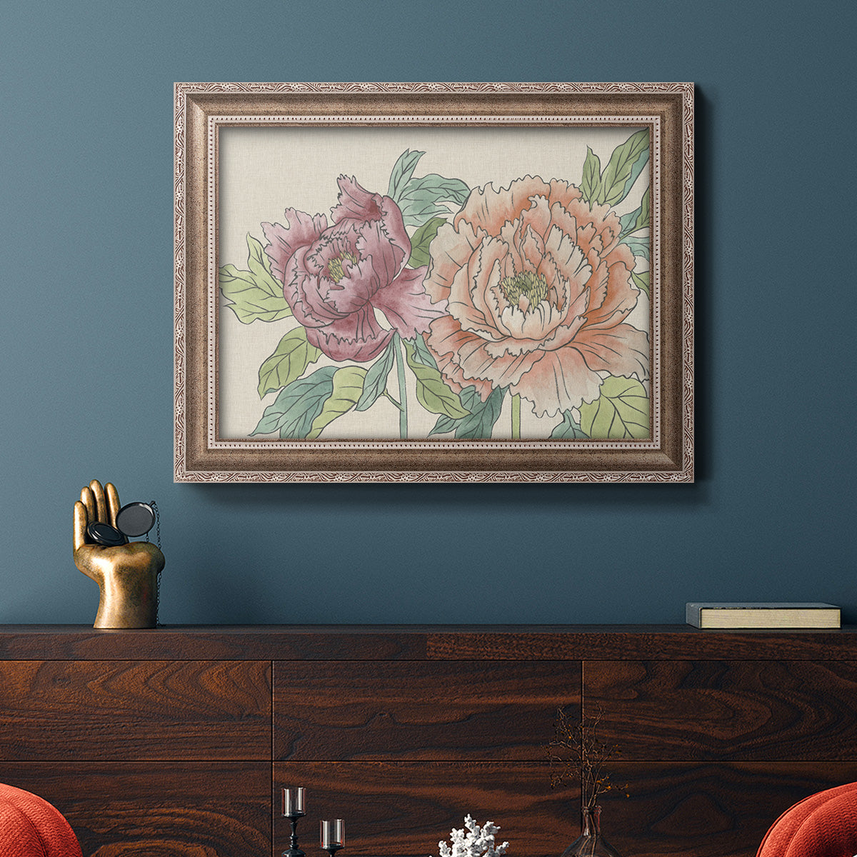 Modern peony floral drawing in an ornate traditional silver frame displayed in a dark-toned interior setting.