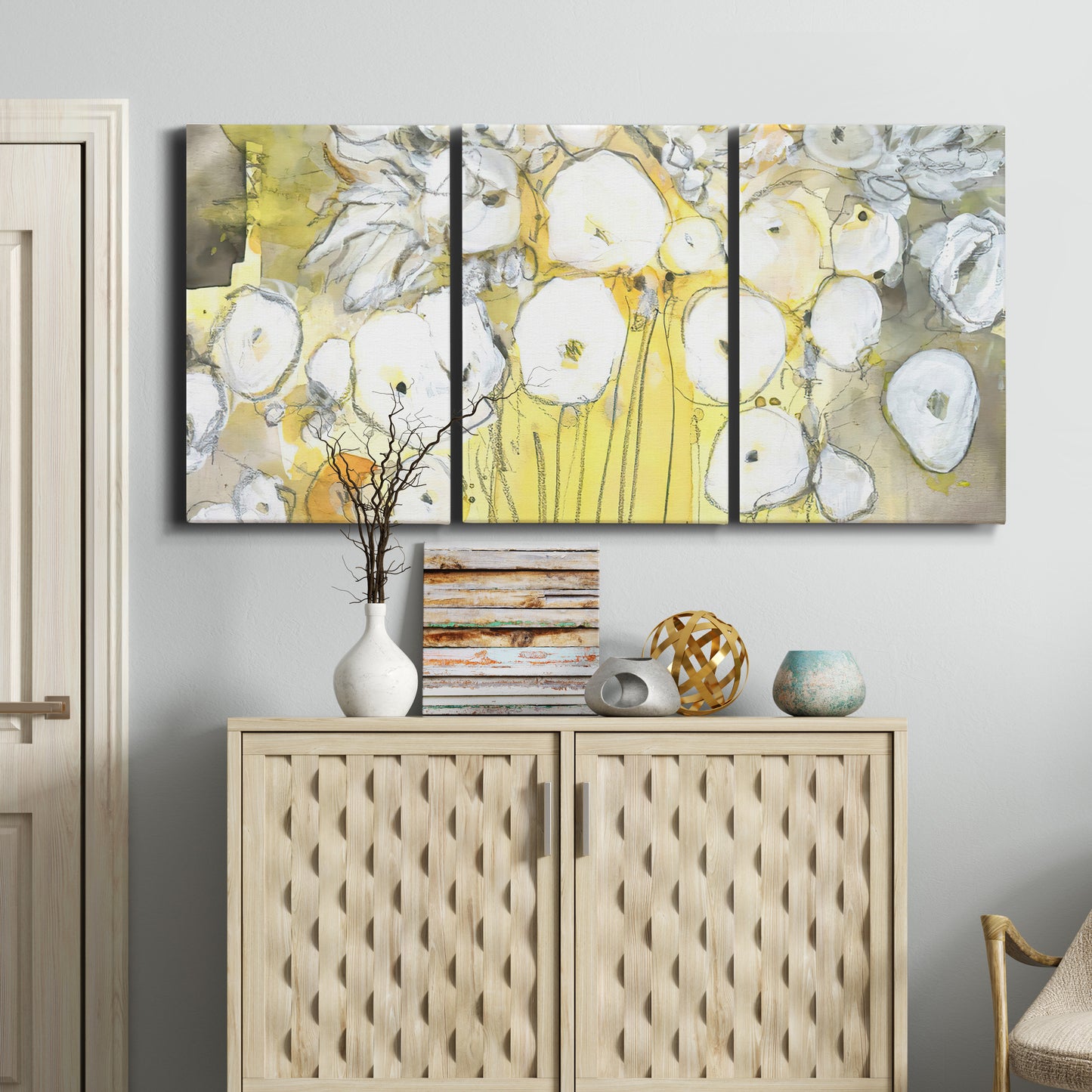 Three-panel canvas wall art featuring vintage inspired floral abstraction, displayed above a cabinet in an entryway.