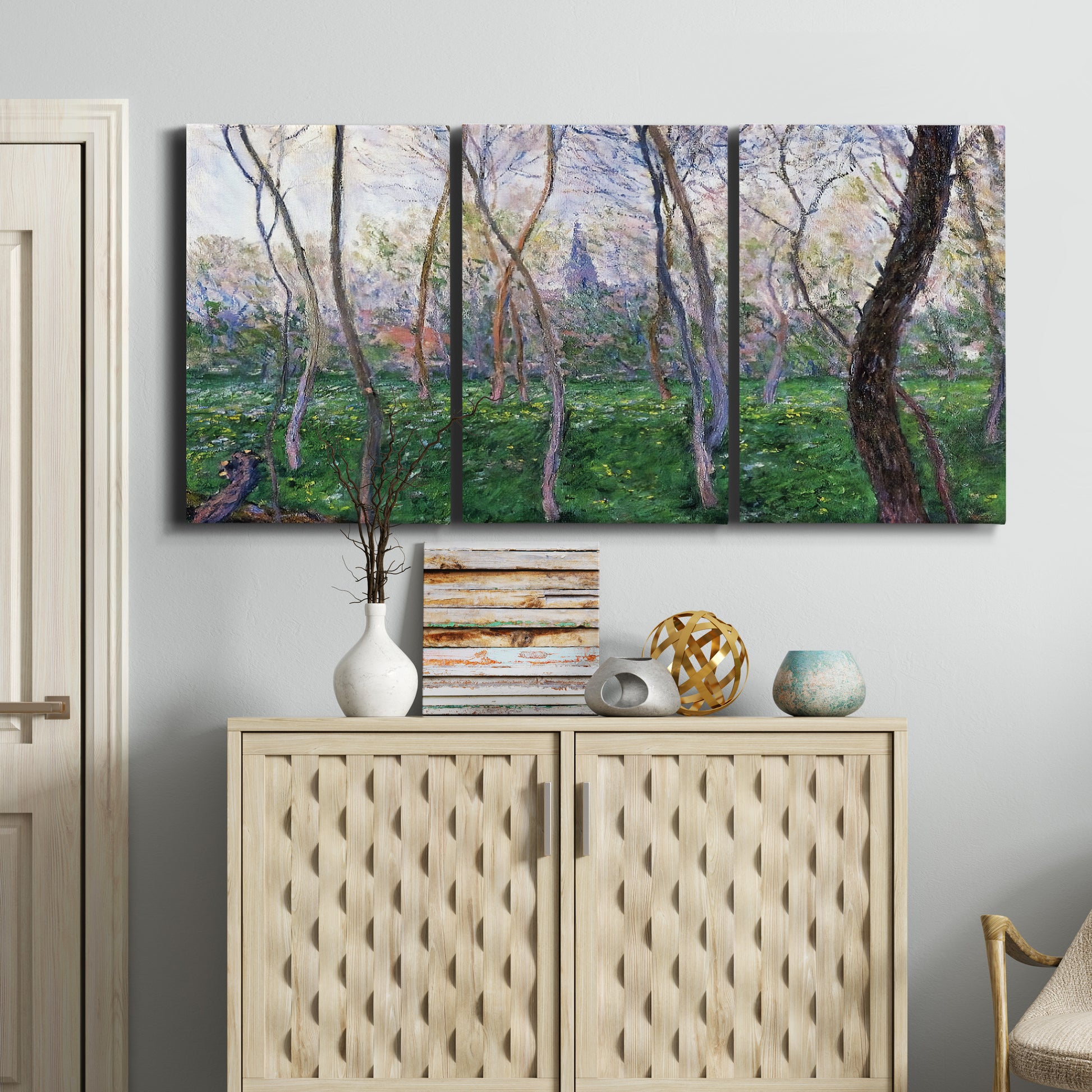 Three-panel canvas wall art featuring spring landscape along river, displayed above a cabinet in an entryway.