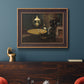 Impressionist domestic interior scene by Claude Monet in an ornate bronzed mahogany wood frame displayed in a dark-toned interior setting.