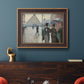 Impressionist urban street scene in the rain by Gustave Caillebotte in an ornate bronzed mahogany wood frame displayed in a dark-toned interior setting.