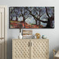 Three-panel canvas wall art featuring pine trees silhouetted at evening, displayed above a cabinet in an entryway.