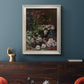 Early impressionist floral painting by Claude Monet in an ornate champagne frame displayed in a dark-toned interior setting.