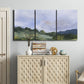 Three-panel canvas wall art featuring wide open pastoral horizon landscape, displayed above a cabinet in an entryway.