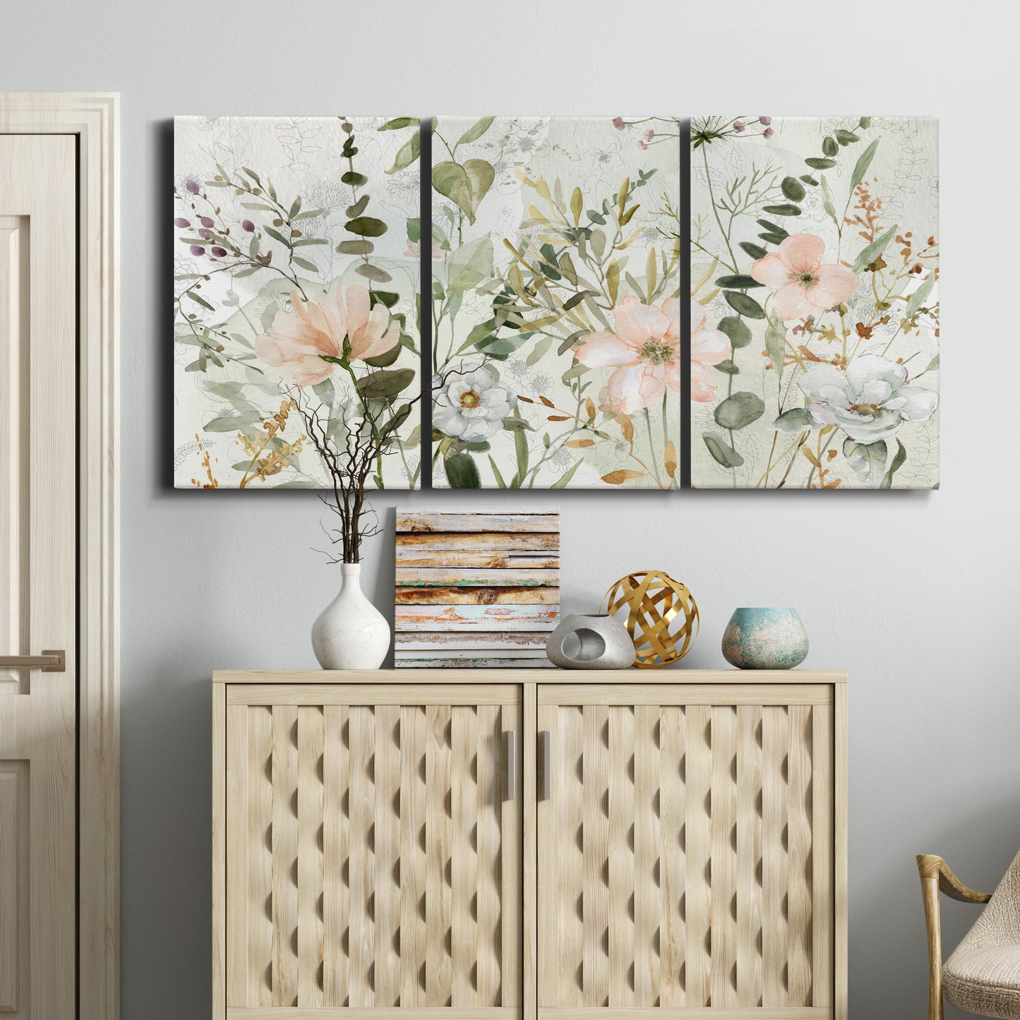 Three-panel canvas wall art featuring vintage floral botanical sketchbook, displayed above a cabinet in an entryway.