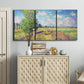 Three-panel canvas wall art featuring sunlit meadow landscape, displayed above a cabinet in an entryway.