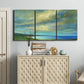 Three-panel canvas wall art featuring coastal shoreline with soft waves, displayed above a cabinet in an entryway.