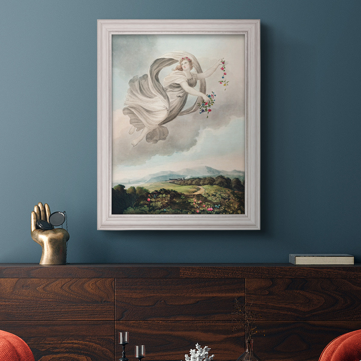 Classical allegorical depiction of the goddess Flora by Robert John Thornton in an ornate weathered white frame displayed in a dark-toned interior setting.