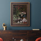 Early impressionist floral painting by Claude Monet in an ornate bronzed mahogany wood frame displayed in a dark-toned interior setting.