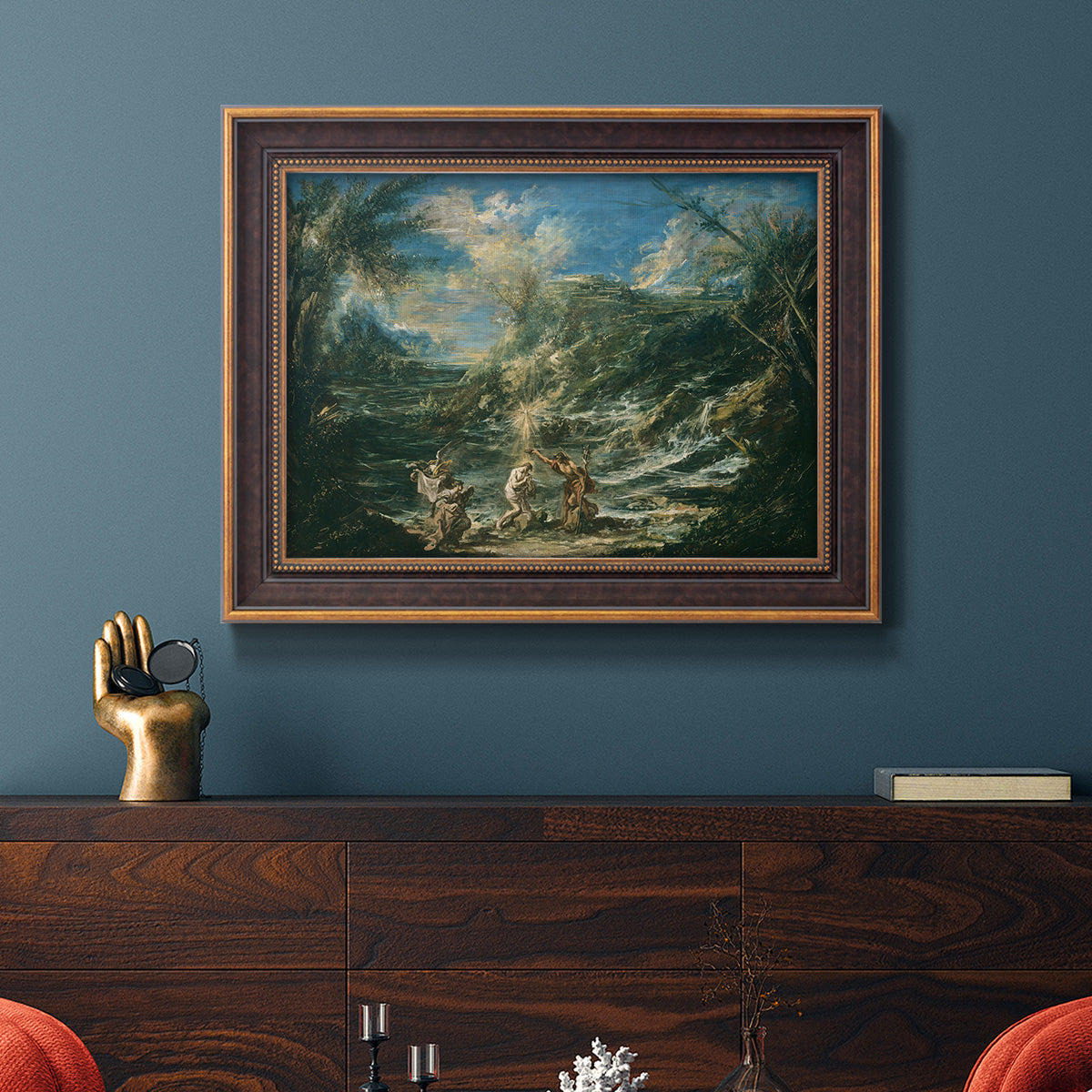 Religious landscape depicting the baptism of Christ by Alessandro Magnasco in an ornate bronzed mahogany wood frame displayed in a dark-toned interior setting.