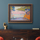 Pointillist coastal seascape by Paul Signac in an ornate bronzed mahogany wood frame displayed in a dark-toned interior setting.