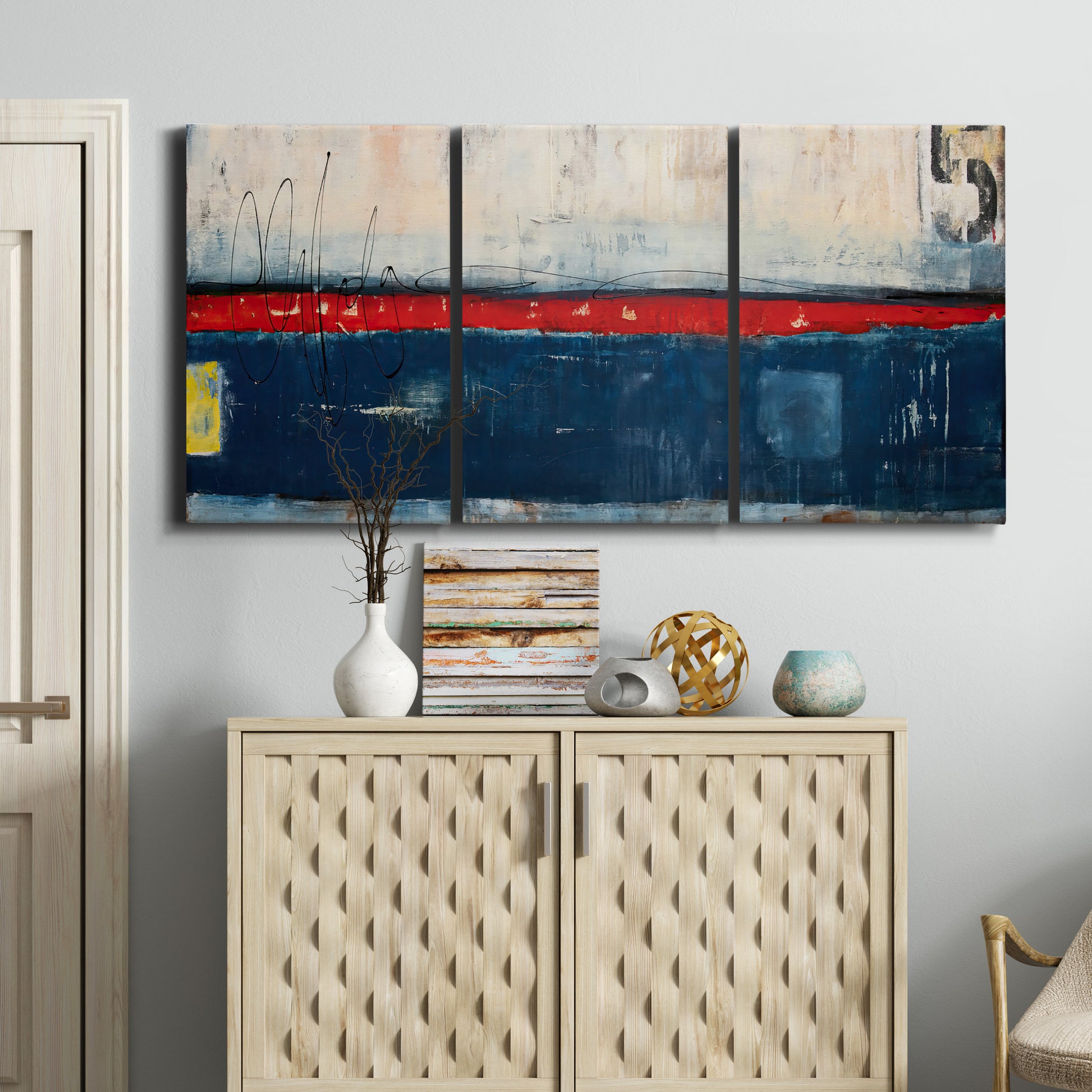 Three-panel canvas wall art featuring weathered coastal dock scene, displayed above a cabinet in an entryway.