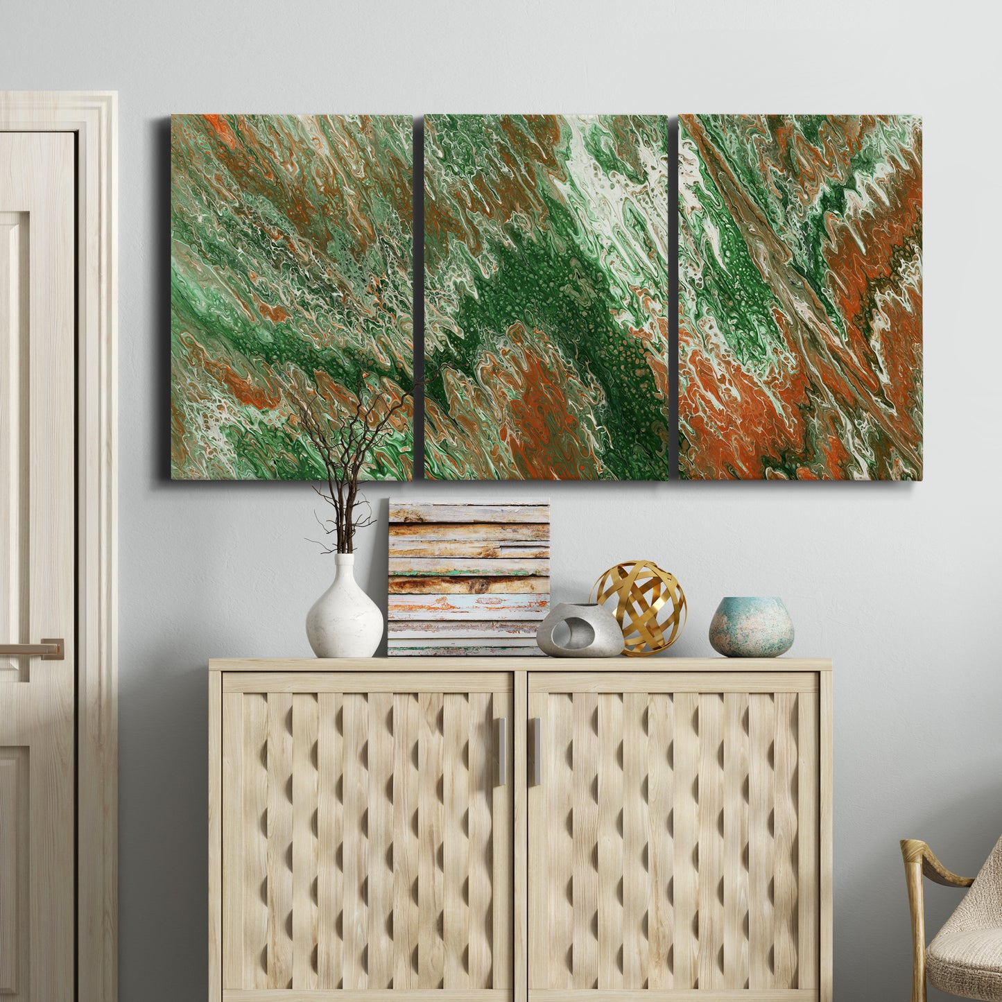 Three-panel canvas wall art featuring modern abstract layered pattern, displayed above a cabinet in an entryway.