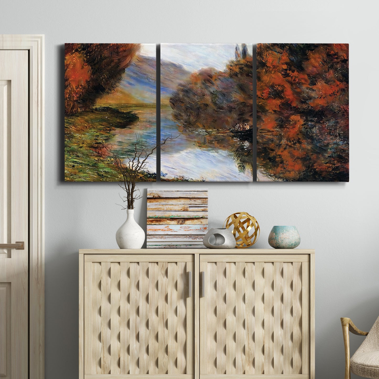 Three-panel canvas wall art featuring rowboat on quiet river bend, displayed above a cabinet in an entryway.