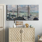 Three-panel canvas wall art featuring rough seas along rocky coast, displayed above a cabinet in an entryway.