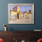 Impressionist Italian village scene by John Singer Sargent in an ornate champagne frame displayed in a dark-toned interior setting.