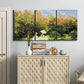Three-panel canvas wall art featuring lush garden landscape with trees, displayed above a cabinet in an entryway.