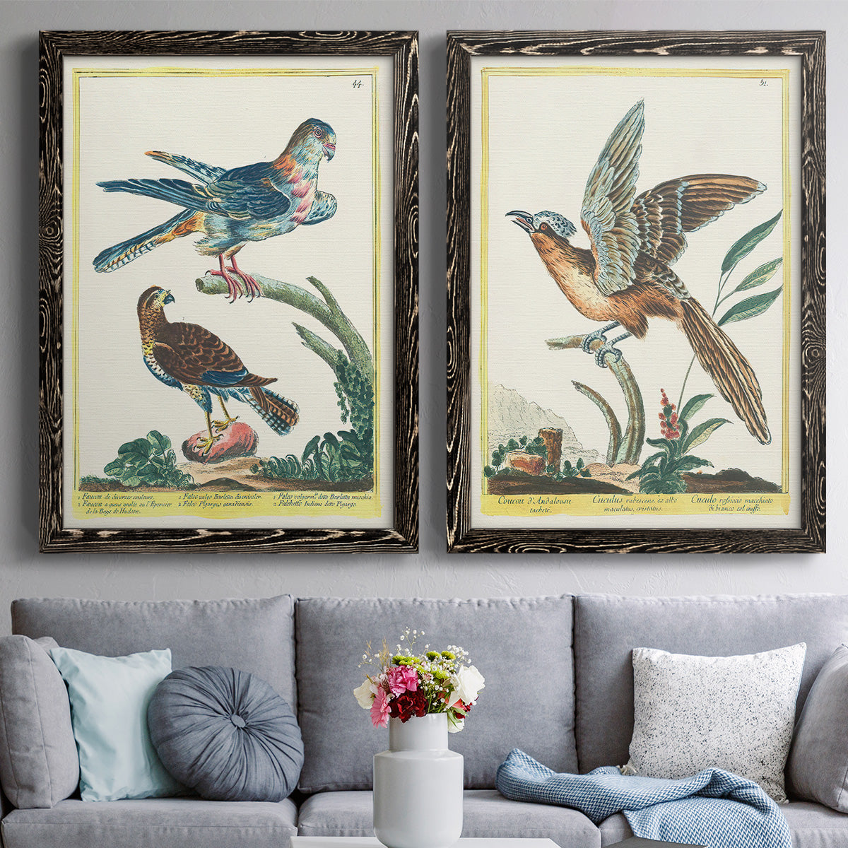 Set of two black barnwood framed canvas prints depicting paired atmospheric abstract paintings with soft clustered strokes, hazy edges, and spacious white fields above a sofa in a contemporary living room.