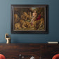 Dramatic biblical painting of Daniel with lions by Peter Paul Rubens in an ornate black frame with gilded inner detail displayed in a dark-toned interior setting.