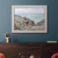 Impressionist coastal watch cabin scene by Claude Monet in an ornate weathered white frame displayed in a dark-toned interior setting.