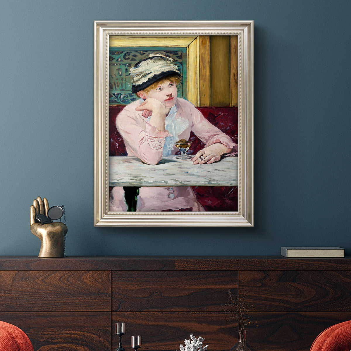 Impressionist portrait scene with plum brandy by Édouard Manet in an ornate champagne frame displayed in a dark-toned interior setting.