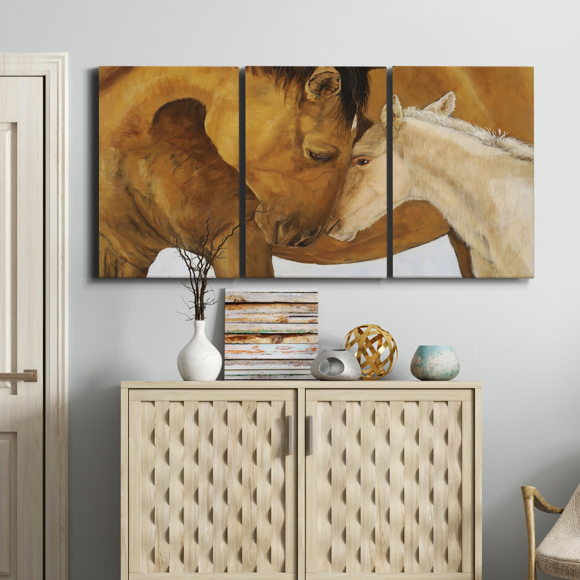 Three-panel canvas wall art featuring gentle horse portrait illustration, displayed above a cabinet in an entryway.