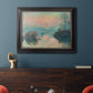 Impressionist winter river sunset scene by Claude Monet in an ornate black frame with gilded inner detail displayed in a dark-toned interior setting.
