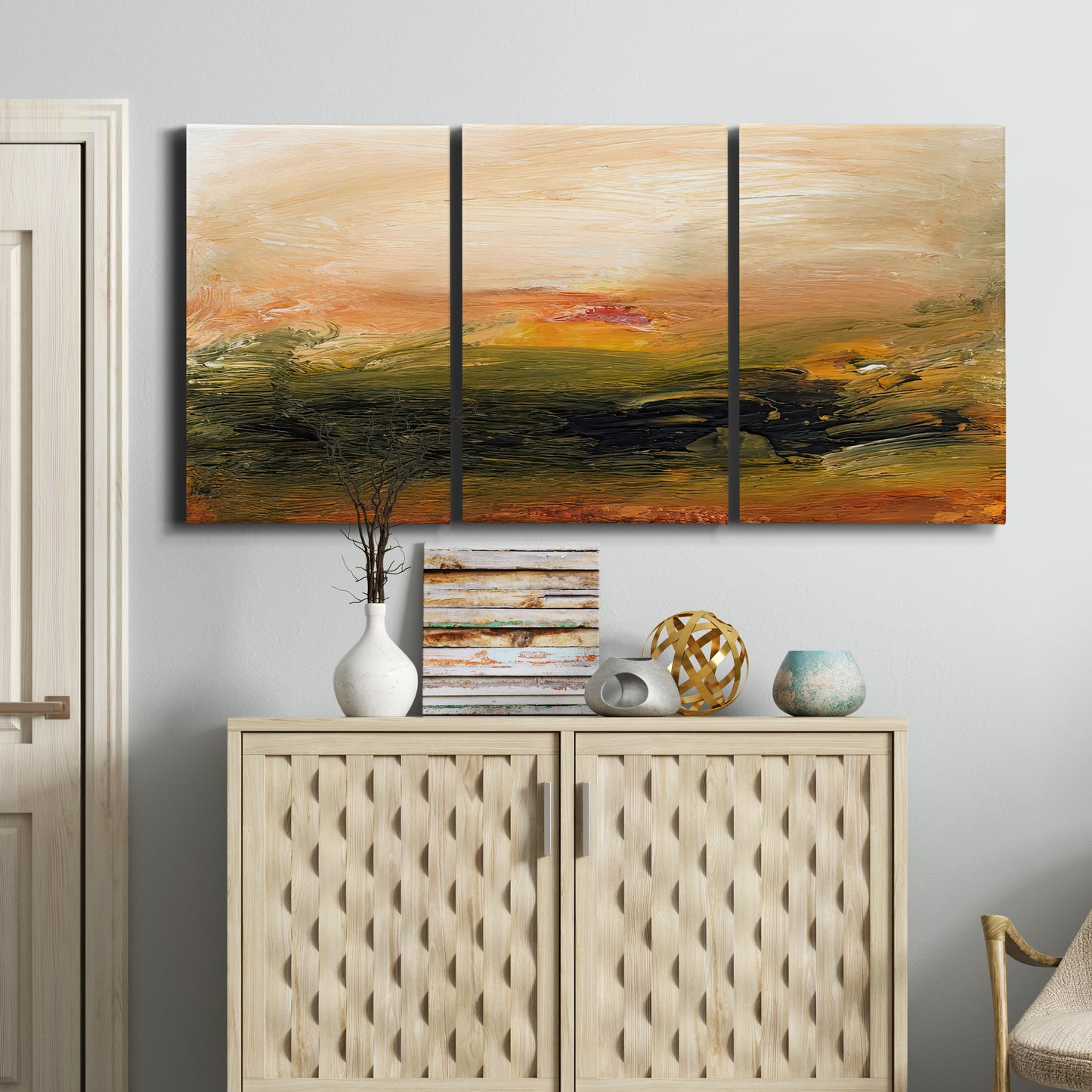 Three-panel canvas wall art featuring soft abstract evening light, displayed above a cabinet in an entryway.