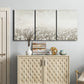 Three-panel canvas wall art featuring dark textured abstract mist, displayed above a cabinet in an entryway.
