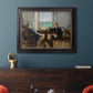 Impressionist interior scene by Édouard Manet in an ornate black frame with gilded inner detail displayed in a dark-toned interior setting.
