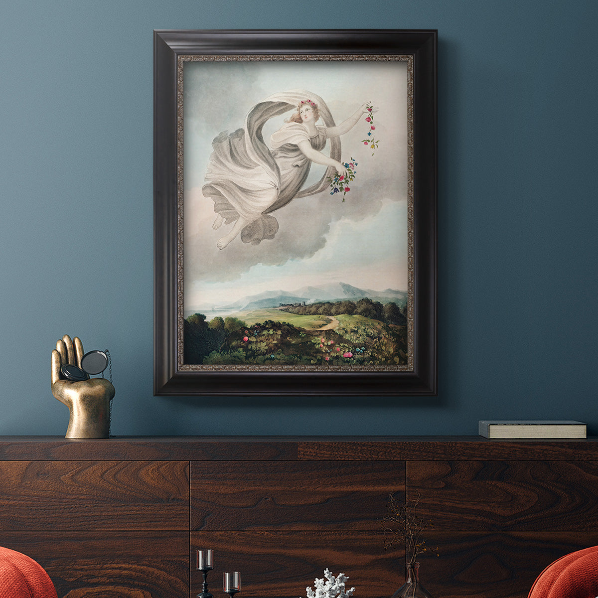 Classical allegorical depiction of the goddess Flora by Robert John Thornton in an ornate black frame with gilded inner detail displayed in a dark-toned interior setting.