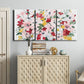 Three-panel canvas wall art featuring joyful spring floral composition, displayed above a cabinet in an entryway.