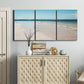 Three-panel canvas wall art featuring white sand beach with gentle waves, displayed above a cabinet in an entryway.
