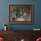 Impressionist backstage ballet scene by Edgar Degas in an ornate bronzed mahogany wood frame displayed in a dark-toned interior setting.