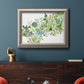 Minimalist abstract succulent botanical watercolor artwork in an ornate vintage silver frame displayed in a dark-toned interior setting.