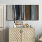 Three-panel canvas wall art featuring layered abstract amusement park tones, displayed above a cabinet in an entryway.