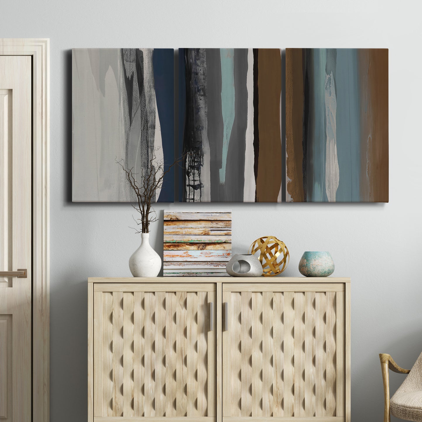 Three-panel canvas wall art featuring layered abstract amusement park tones, displayed above a cabinet in an entryway.