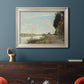 Impressionist river scene with red boats by Claude Monet in an ornate champagne frame displayed in a dark-toned interior setting.