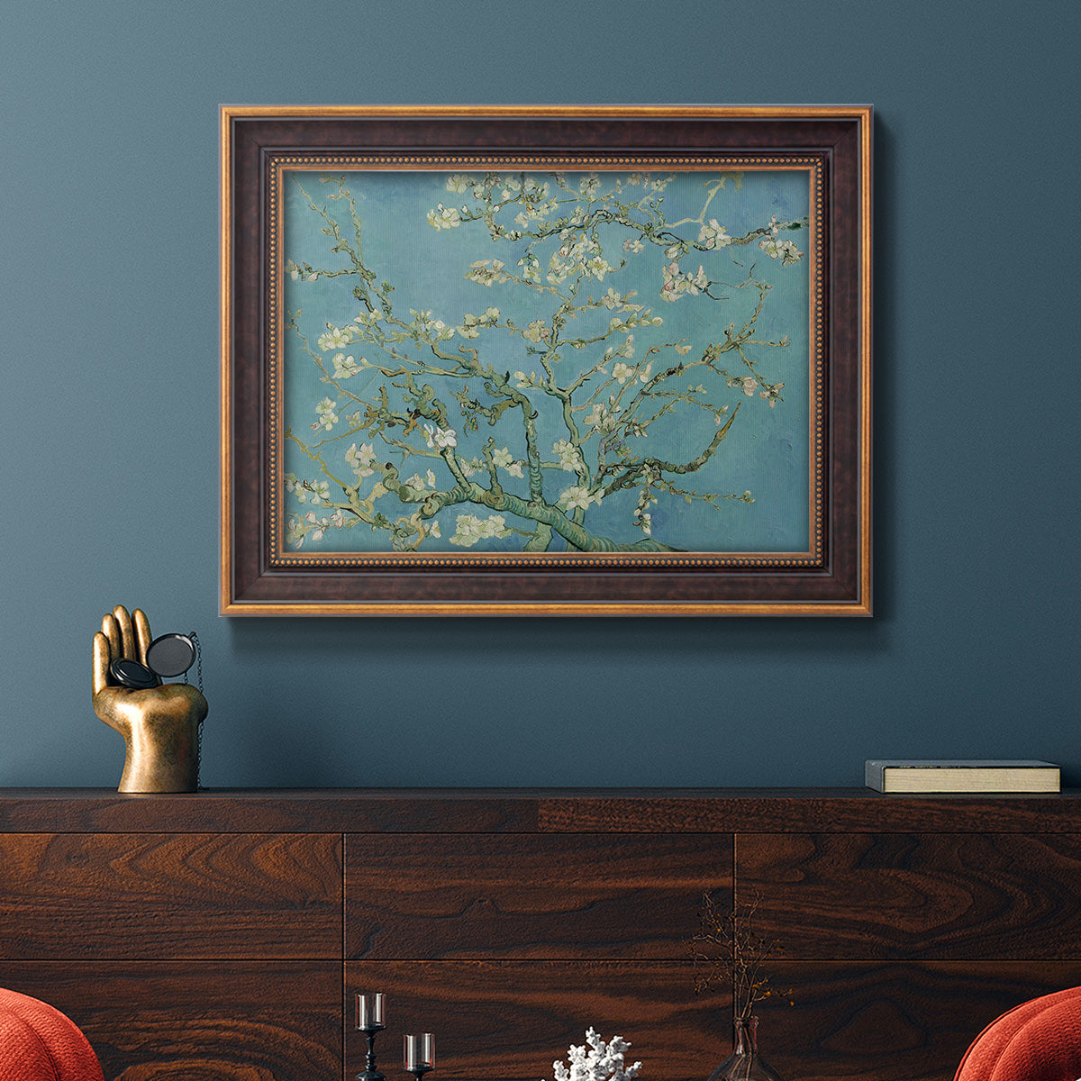 Impressionist flowering almond branch painting by Vincent van Gogh in an ornate bronzed mahogany wood frame displayed in a dark-toned interior setting.