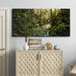 Three-panel canvas wall art featuring sun filtered woodland photograph, displayed above a cabinet in an entryway.