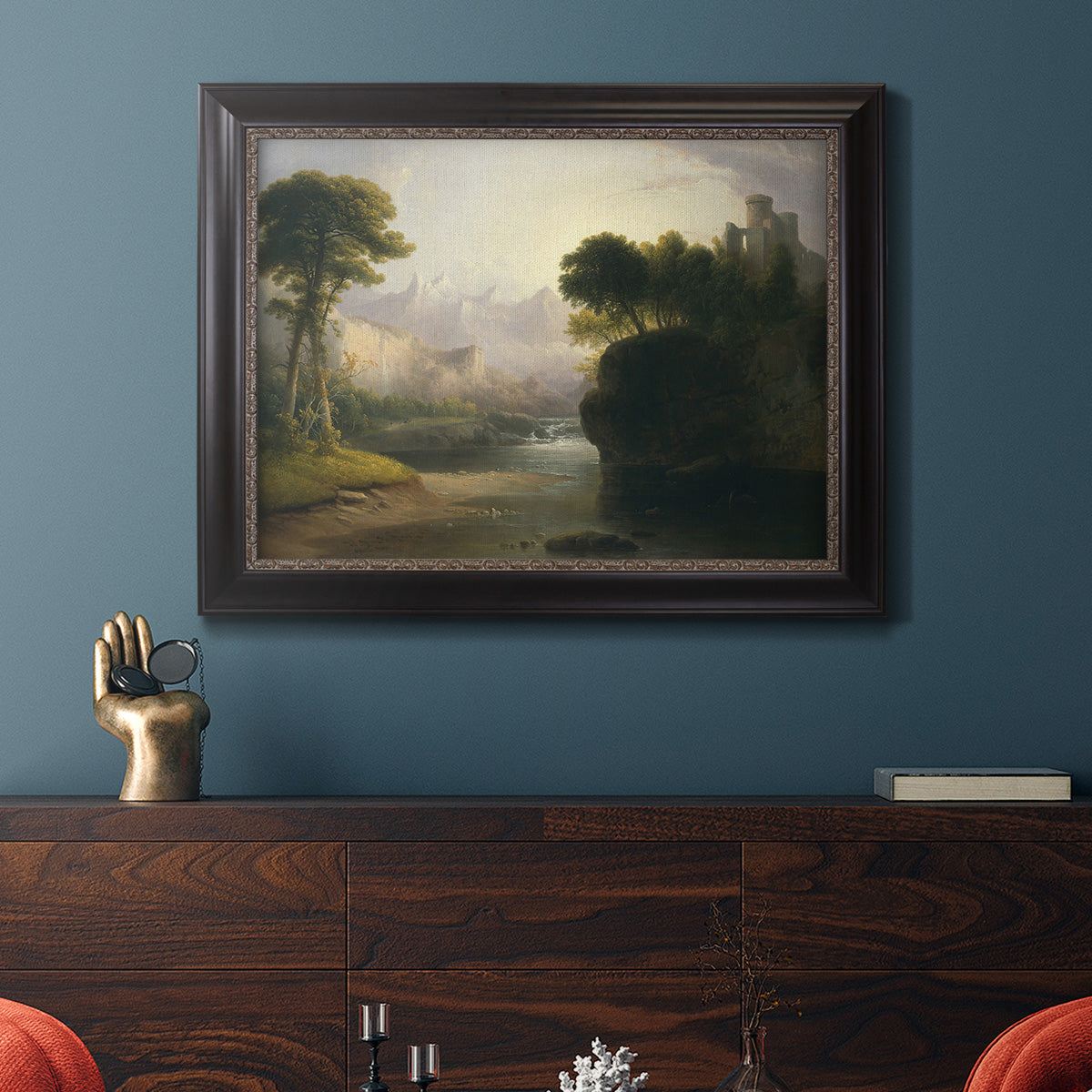 Romantic autumn landscape along the Hudson River by Thomas Doughty in an ornate black frame with gilded inner detail displayed in a dark-toned interior setting.