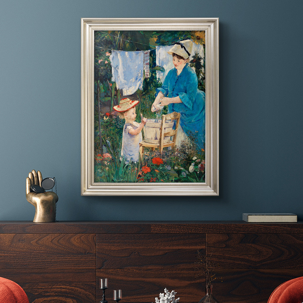 Intimate domestic genre scene by Édouard Manet in an ornate champagne frame displayed in a dark-toned interior setting.