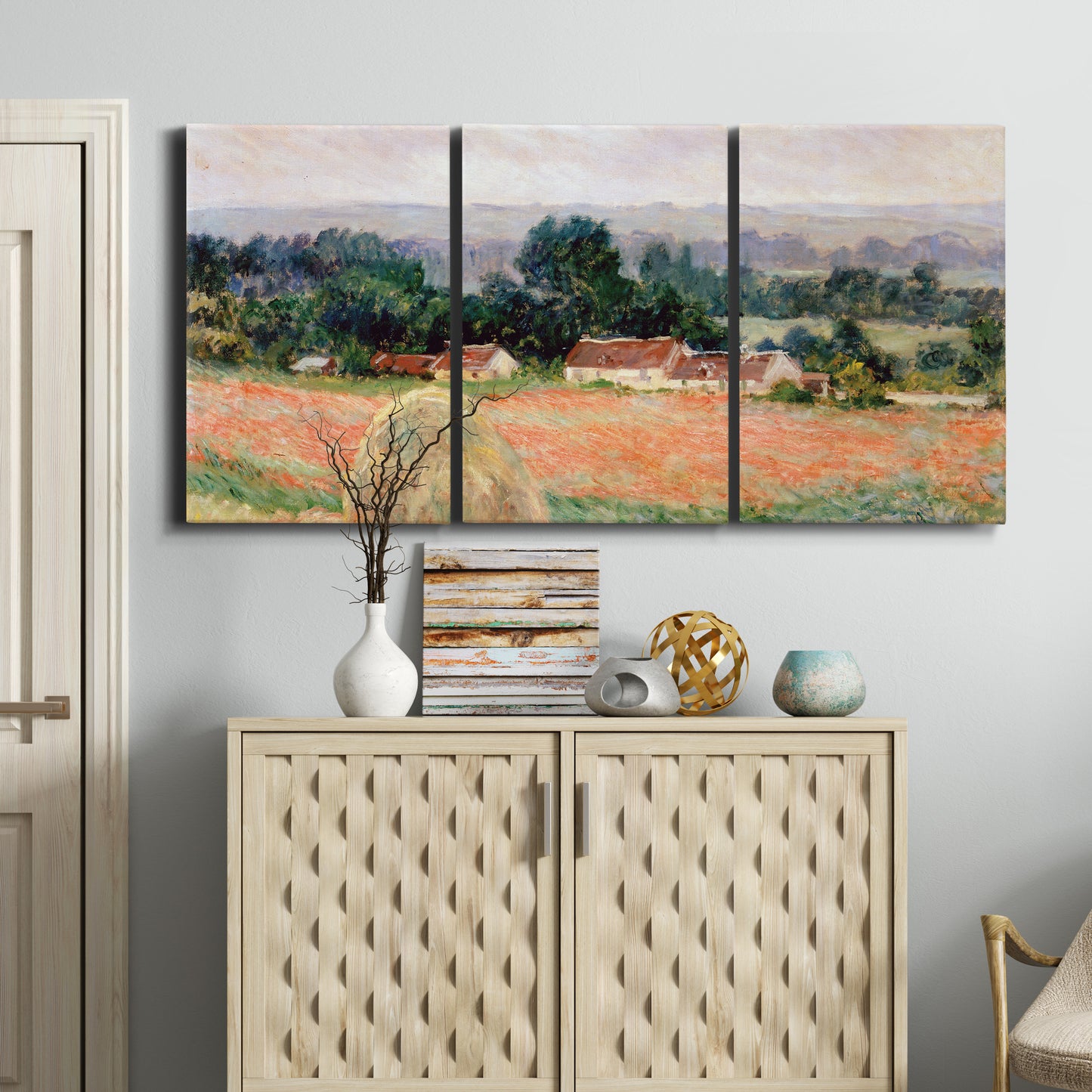 Three-panel canvas wall art featuring haystacks arranged in rural field, displayed above a cabinet in an entryway.
