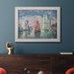 Impressionist harbor scene by Paul Signac in an ornate weathered white frame displayed in a dark-toned interior setting.