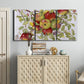 Three-panel canvas wall art featuring apples hanging from branch, displayed above a cabinet in an entryway.
