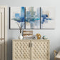 Three-panel canvas wall art featuring minimal urban skyline watercolor, displayed above a cabinet in an entryway.