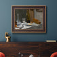 Impressionist still life with wine and bread by Claude Monet in an ornate bronzed mahogany wood frame displayed in a dark-toned interior setting.